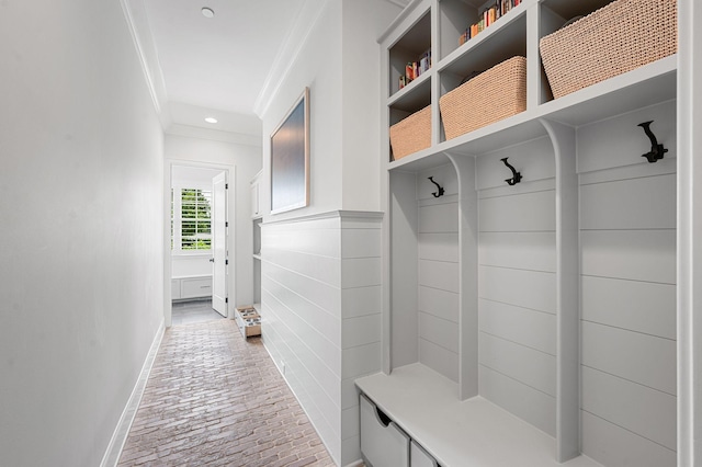 1542 Amesbury Ln, Franklin, TN 37069 - mudroom with ornamental molding, brick floors, and recessed lighting