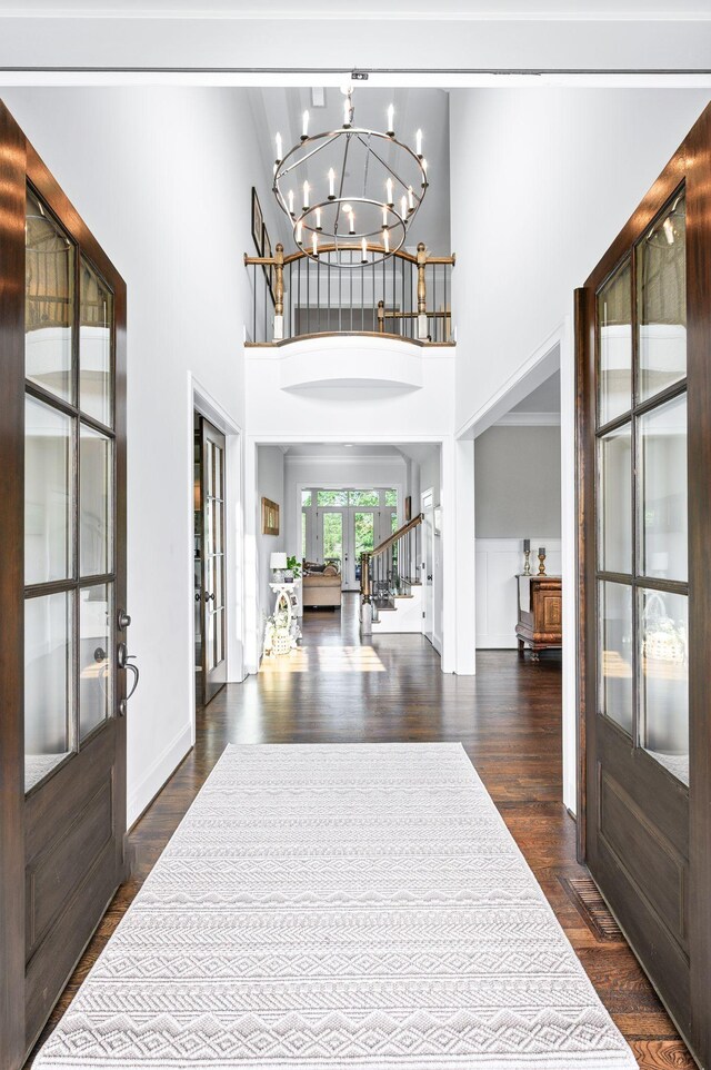 1542 Amesbury Ln, Franklin, TN 37069 - entryway featuring french doors, a chandelier, a high ceiling, and dark wood finished floors
