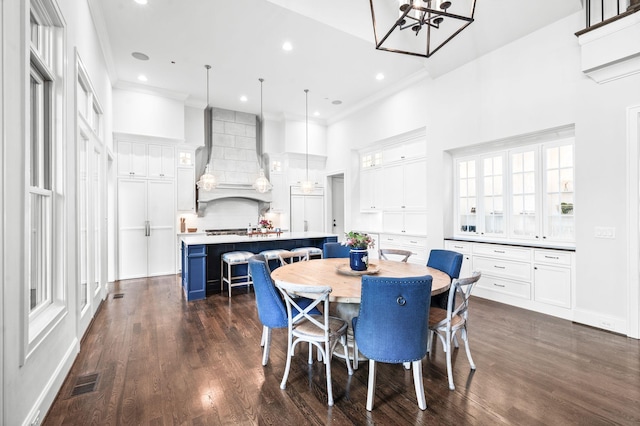 1542 Amesbury Ln, Franklin, TN 37069 - dining space with a chandelier, a high ceiling, crown molding, dark wood-type flooring, and recessed lighting