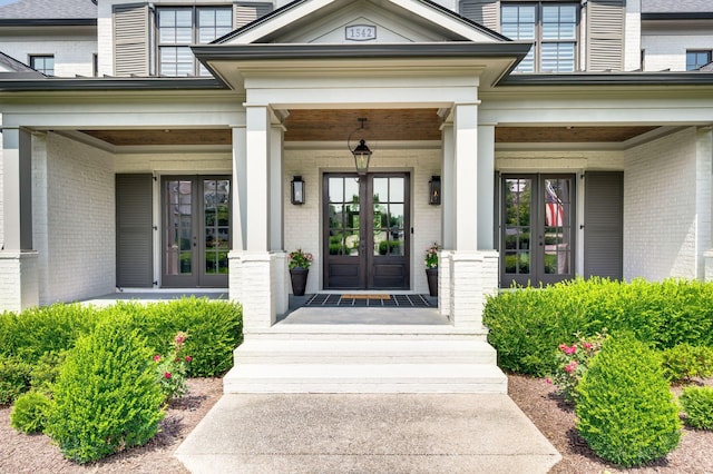 1542 Amesbury Ln, Franklin, TN 37069 - property entrance with french doors, a porch, and brick siding