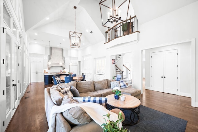 1542 Amesbury Ln, Franklin, TN 37069 - living area with a chandelier, a towering ceiling, stairs, dark wood-style floors, and recessed lighting
