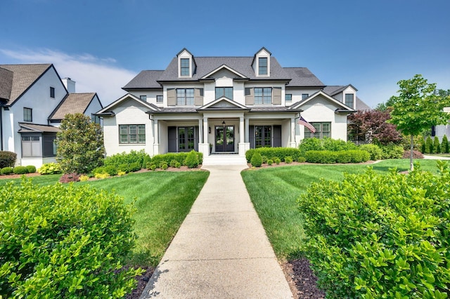 1542 Amesbury Ln, Franklin, TN 37069 - view of front of property with a standing seam roof, a front lawn, and a metal roof