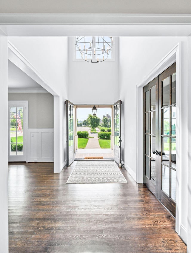 1542 Amesbury Ln, Franklin, TN 37069 - entryway with french doors, a chandelier, ornamental molding, dark wood finished floors, and a high ceiling