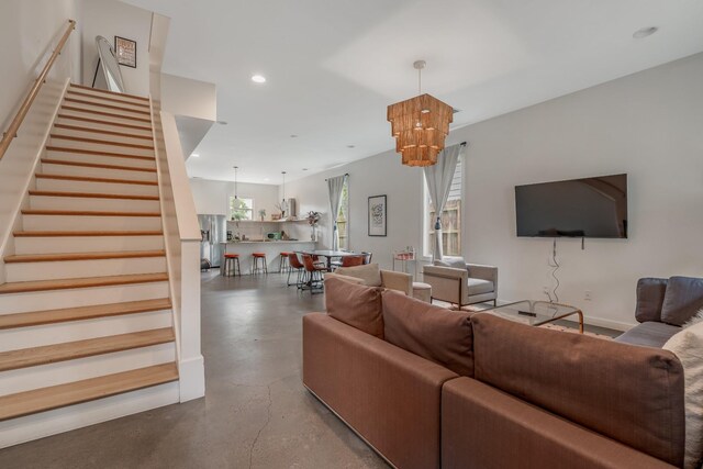203 N 9th St Unit A/B, Nashville, TN 37206 - living room featuring finished concrete floors, stairs, a chandelier, and recessed lighting