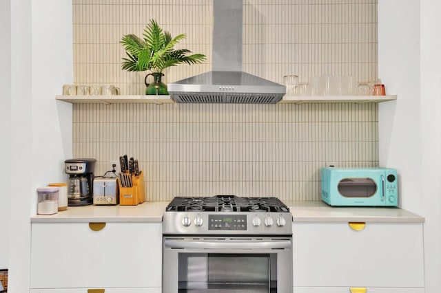 203 N 9th St Unit A/B, Nashville, TN 37206 - kitchen with stainless steel range with gas stovetop, wall chimney range hood, white microwave, decorative backsplash, and light countertops