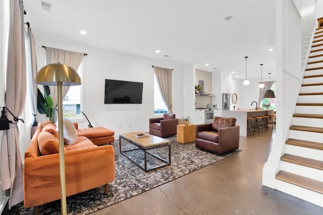 203 N 9th St Unit A/B, Nashville, TN 37206 - living area featuring stairs, recessed lighting, and concrete floors