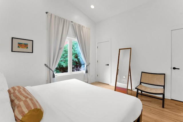 203 N 9th St Unit A/B, Nashville, TN 37206 - bedroom with light wood-style flooring and high vaulted ceiling
