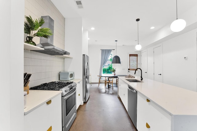 203 N 9th St Unit A/B, Nashville, TN 37206 - kitchen featuring appliances with stainless steel finishes, recessed lighting, decorative backsplash, an island with sink, and white cabinetry