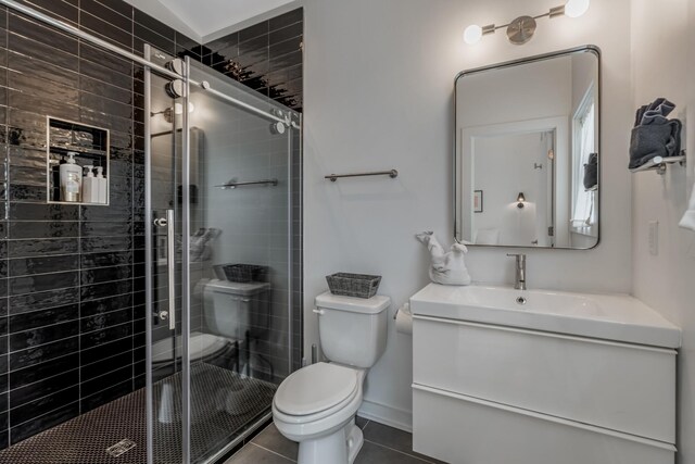 203 N 9th St Unit A/B, Nashville, TN 37206 - bathroom with vanity, a shower stall, and tile patterned floors