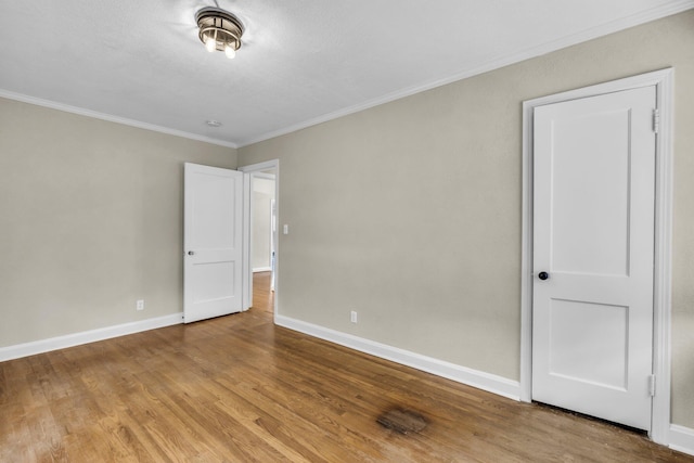 702 Marlboro Ave, Chattanooga, TN 37412 - unfurnished bedroom featuring ornamental molding and wood finished floors