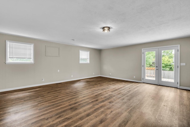 702 Marlboro Ave, Chattanooga, TN 37412 - empty room with wood finished floors, a textured ceiling, and french doors