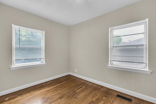702 Marlboro Ave, Chattanooga, TN 37412 - empty room with plenty of natural light and wood finished floors