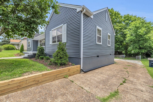 702 Marlboro Ave, Chattanooga, TN 37412 - view of property exterior with crawl space and a lawn