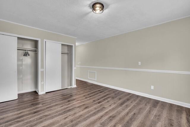 702 Marlboro Ave, Chattanooga, TN 37412 - unfurnished bedroom with wood finished floors and multiple closets