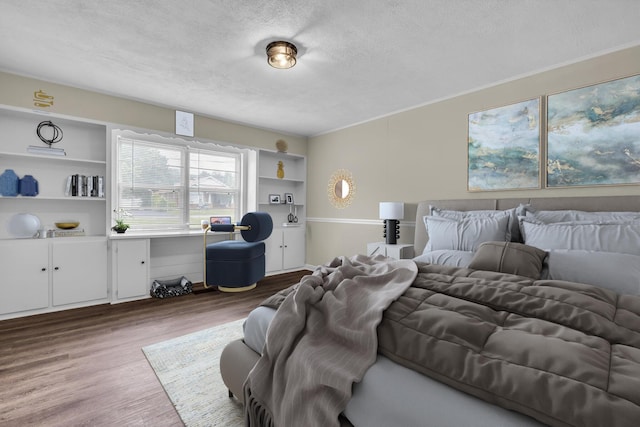 702 Marlboro Ave, Chattanooga, TN 37412 - bedroom featuring a textured ceiling and wood finished floors