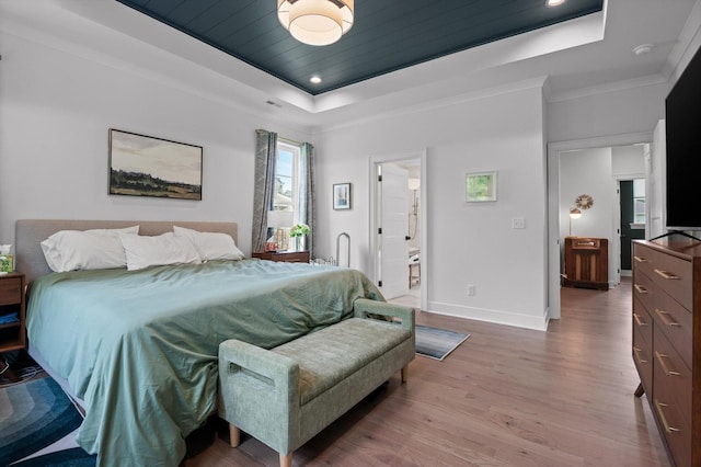 4141 Barnsley Loop, Ooltewah, TN 37363 - bedroom featuring a raised ceiling, wood finished floors, ornamental molding, recessed lighting, and connected bathroom