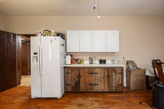 431 Haddon Ln, Winchester, TN 37398 - kitchen featuring white refrigerator with ice dispenser, white cabinets, wood finished floors, and light countertops