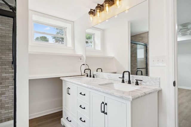 415 Porter Cir, Columbia, TN 38401 - bathroom featuring double vanity, wood finished floors, and a stall shower