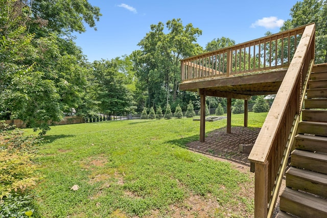 415 Porter Cir, Columbia, TN 38401 - view of green lawn with stairway and a wooden deck