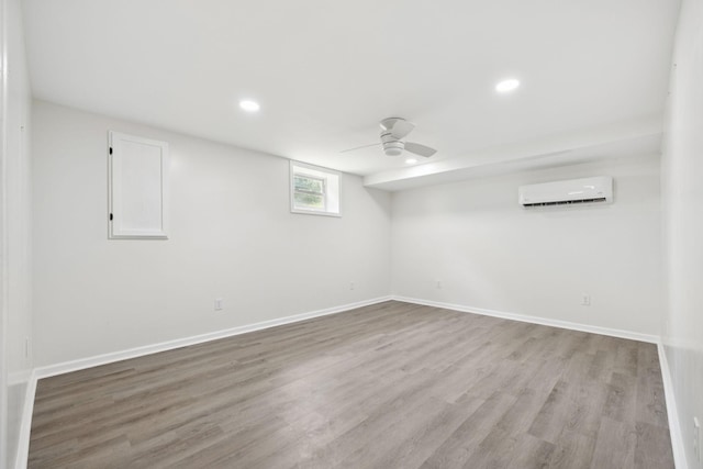 415 Porter Cir, Columbia, TN 38401 - unfurnished room with a wall unit AC, light wood-style floors, recessed lighting, and a ceiling fan