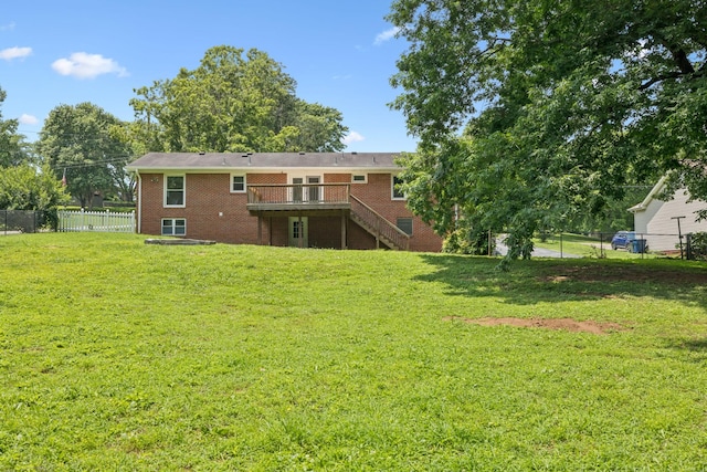 415 Porter Cir, Columbia, TN 38401 - rear view of house featuring stairs, brick siding, and a deck