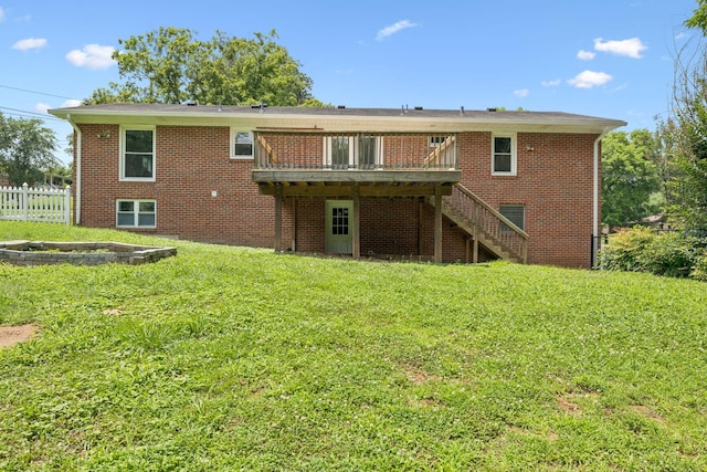 415 Porter Cir, Columbia, TN 38401 - back of property with a wooden deck, stairway, and brick siding