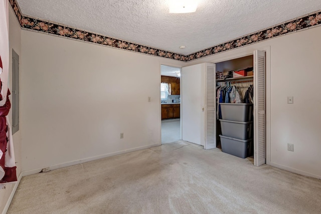 303 Furnace Hollow Rd, Dickson, TN 37055 - unfurnished bedroom with a textured ceiling, carpet flooring, and a closet