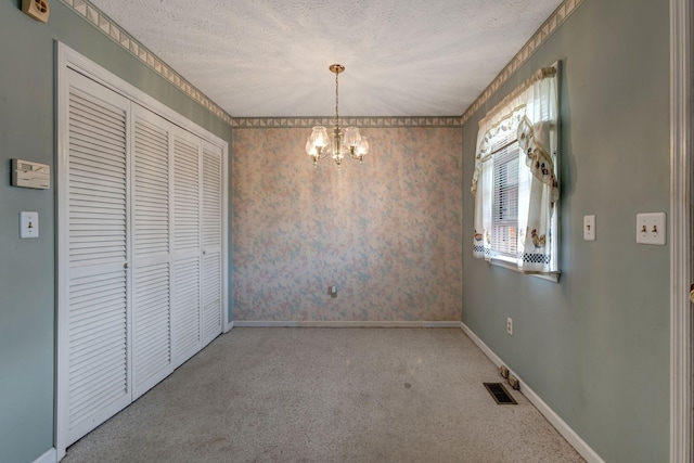 303 Furnace Hollow Rd, Dickson, TN 37055 - unfurnished dining area with carpet, a chandelier, and a textured ceiling