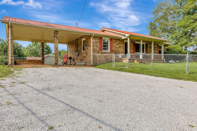 303 Furnace Hollow Rd, Dickson, TN 37055 - view of front of home featuring driveway, brick siding, a metal roof, and a carport