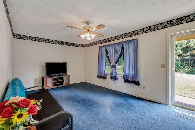 303 Furnace Hollow Rd, Dickson, TN 37055 - living area featuring dark carpet, a ceiling fan, and a textured ceiling