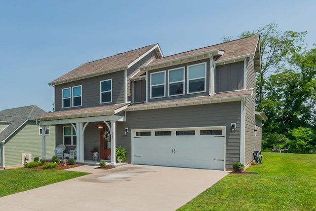 588 Davis Valley Dr, Columbia, TN 38401 - view of front facade featuring covered porch, a garage, a front lawn, driveway, and board and batten siding