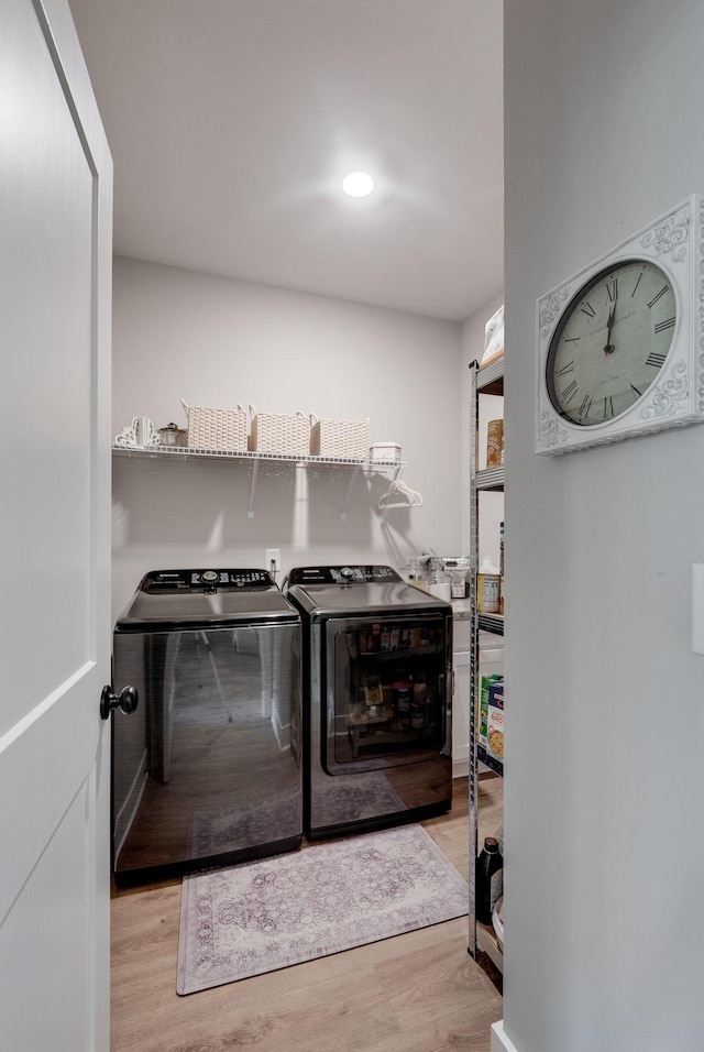 588 Davis Valley Dr, Columbia, TN 38401 - laundry room featuring washing machine and dryer and wood finished floors