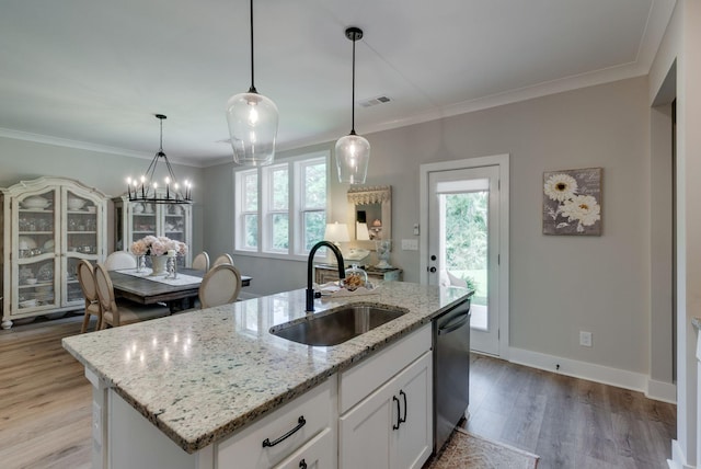588 Davis Valley Dr, Columbia, TN 38401 - kitchen featuring stainless steel dishwasher, plenty of natural light, light wood-style floors, white cabinets, and crown molding