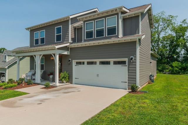 588 Davis Valley Dr, Columbia, TN 38401 - view of front facade with an attached garage, covered porch, a front lawn, and concrete driveway