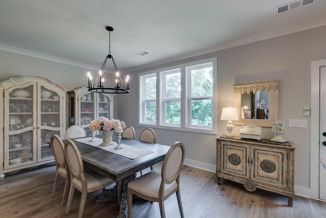 588 Davis Valley Dr, Columbia, TN 38401 - dining area featuring a chandelier, wood finished floors, and crown molding