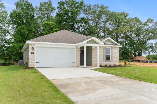 15 Aurora Cir, Fayetteville, TN 37334 - ranch-style home with brick siding, driveway, an attached garage, a front yard, and a shingled roof