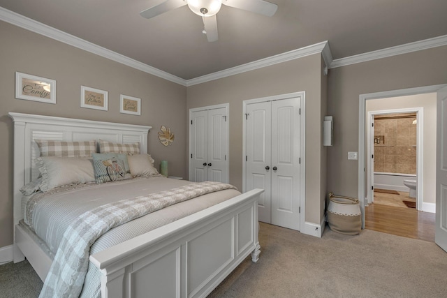 122 Ridgebend Dr, Murfreesboro, TN 37128 - bedroom with crown molding, two closets, light colored carpet, and a ceiling fan