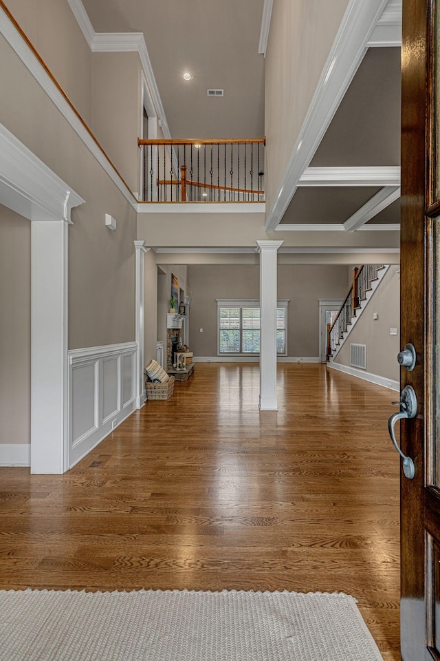 122 Ridgebend Dr, Murfreesboro, TN 37128 - foyer with a high ceiling, stairway, wood finished floors, decorative columns, and recessed lighting