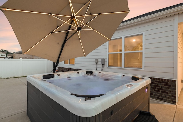 8044 Typhani Way, White House, TN 37188 - patio terrace at dusk featuring a hot tub
