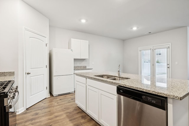 8044 Typhani Way, White House, TN 37188 - kitchen with appliances with stainless steel finishes, white cabinetry, light stone countertops, an island with sink, and light wood finished floors