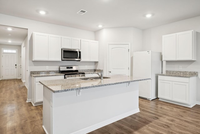 8044 Typhani Way, White House, TN 37188 - kitchen featuring stainless steel appliances, white cabinets, an island with sink, and recessed lighting