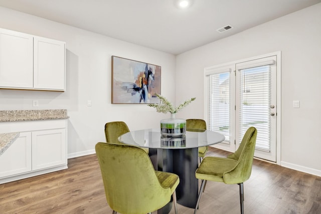 8044 Typhani Way, White House, TN 37188 - dining room with light wood-style flooring and baseboards