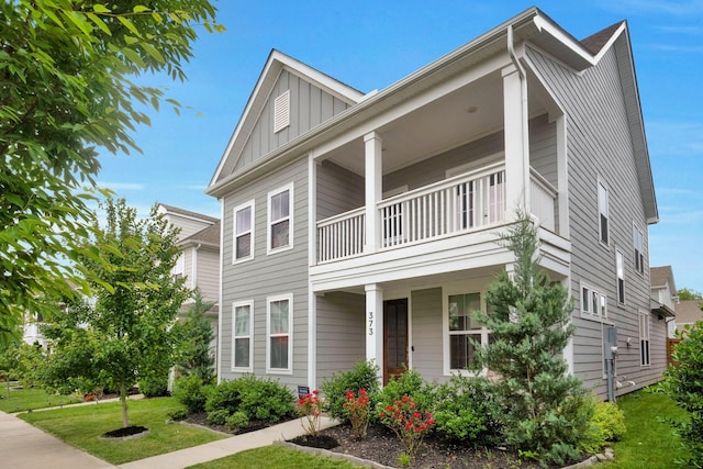 373 Hammock Ln, Spring Hill, TN 37174 - view of front of home featuring a balcony, board and batten siding, a porch, and a front lawn