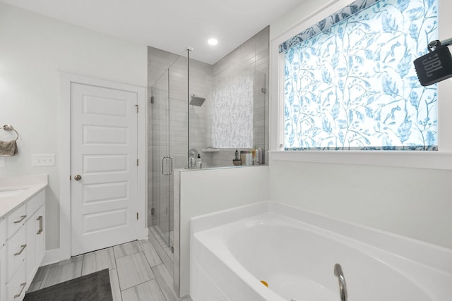 373 Hammock Ln, Spring Hill, TN 37174 - bathroom featuring a garden tub, a stall shower, vanity, and recessed lighting