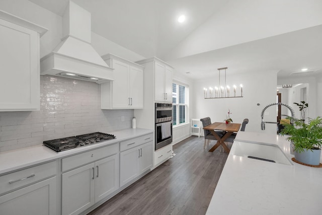 373 Hammock Ln, Spring Hill, TN 37174 - kitchen featuring premium range hood, appliances with stainless steel finishes, backsplash, light countertops, and recessed lighting
