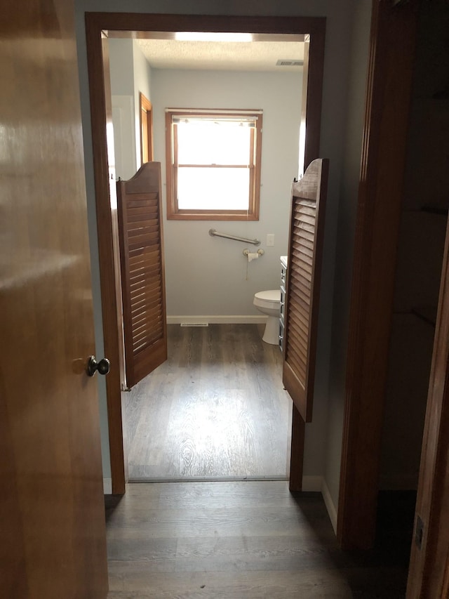 233 W Chestnut St, Puryear, TN 38251 - bathroom with toilet and wood finished floors