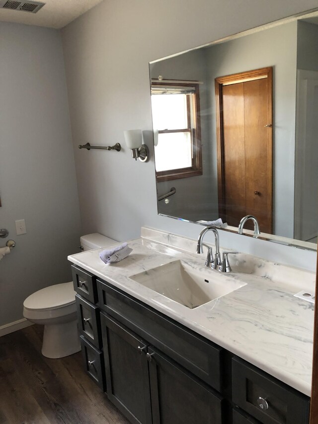 233 W Chestnut St, Puryear, TN 38251 - half bath featuring wood finished floors and vanity