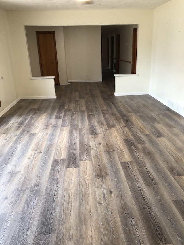 233 W Chestnut St, Puryear, TN 38251 - empty room with dark wood-style flooring and baseboards