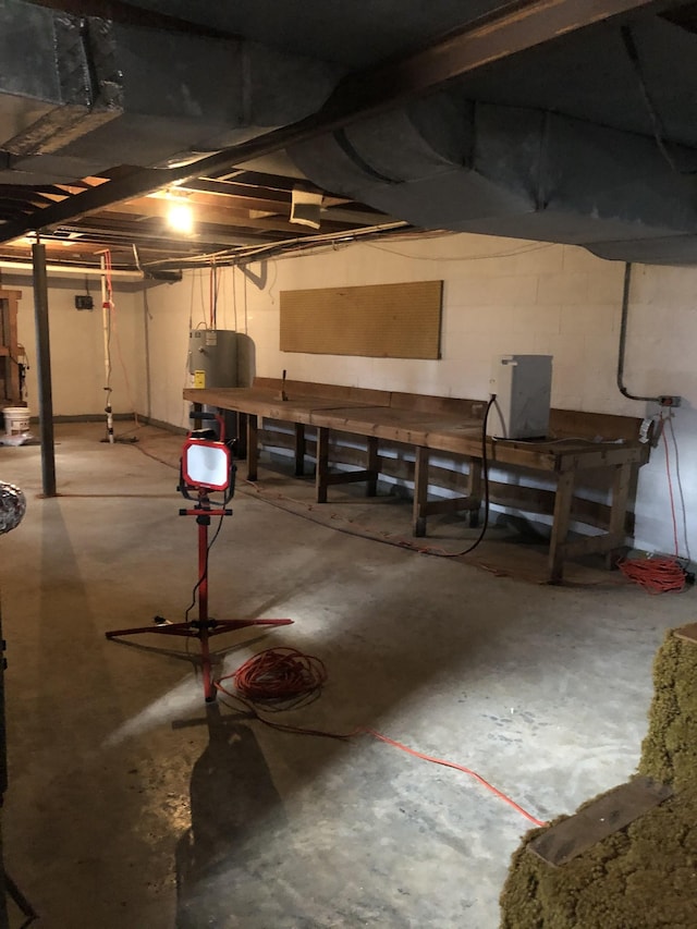233 W Chestnut St, Puryear, TN 38251 - unfinished basement with water heater