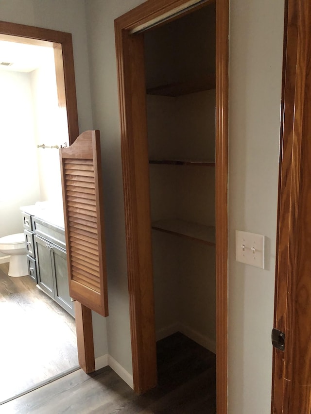 233 W Chestnut St, Puryear, TN 38251 - bathroom with wood finished floors and vanity
